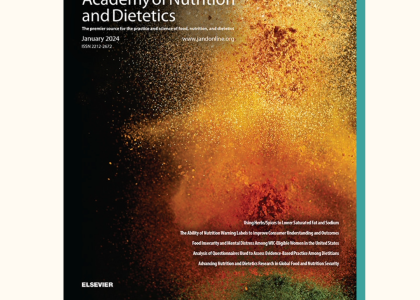 The January cover of the Journal of the Academy of Nutrition and Dietetics. The journal cover is black with yellow, orange, red, and green spices thrown into the air. 