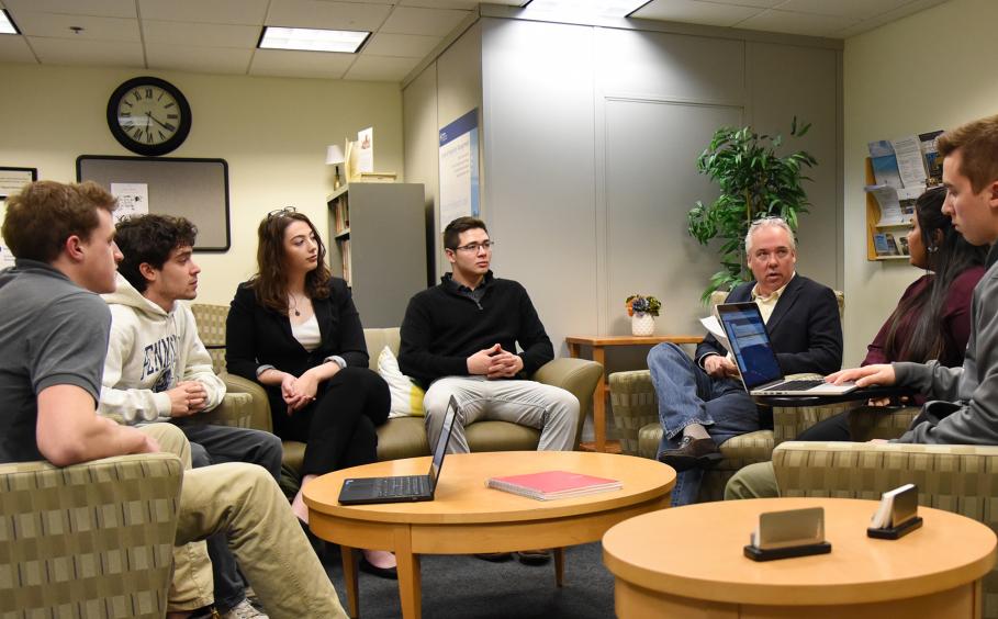 Dr. Mike Ahlgren and student officers of Penn State’s Casino Management Club discuss an upcoming trip to tour properties and meet with casino managers.