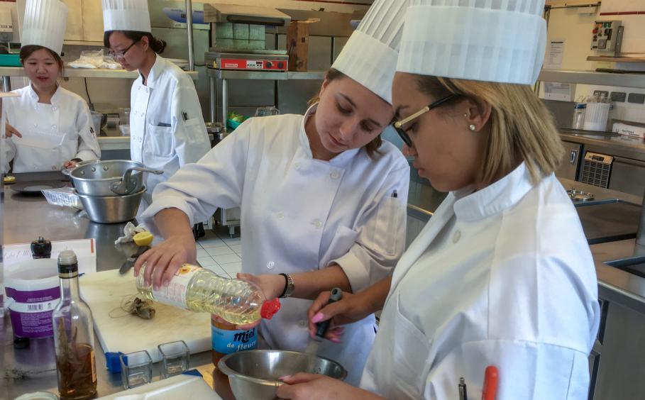 Students conducting research in an international research kitchen. 