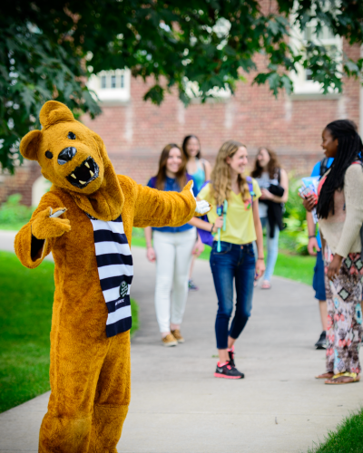 Nittany Lion welcoming you with students in the background