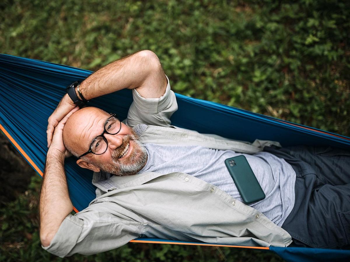 man laying in hammock 