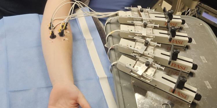 A research subject hooked up to sensors that measure their blood flow.