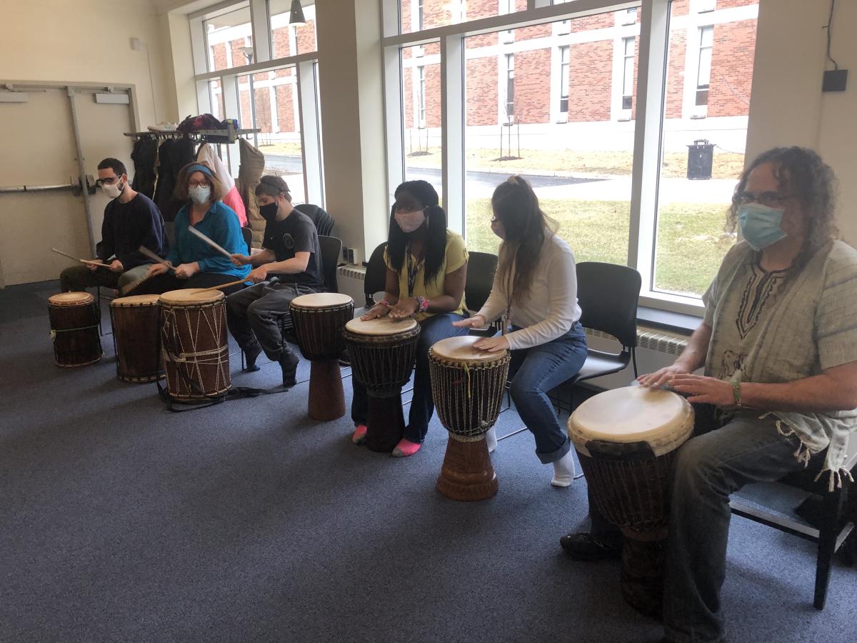 =Students in CSD 240 practice drumming
