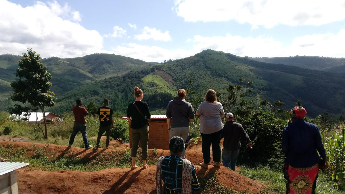 =Global Health Minor students overlooking a valley in Tanzania where a water project is located