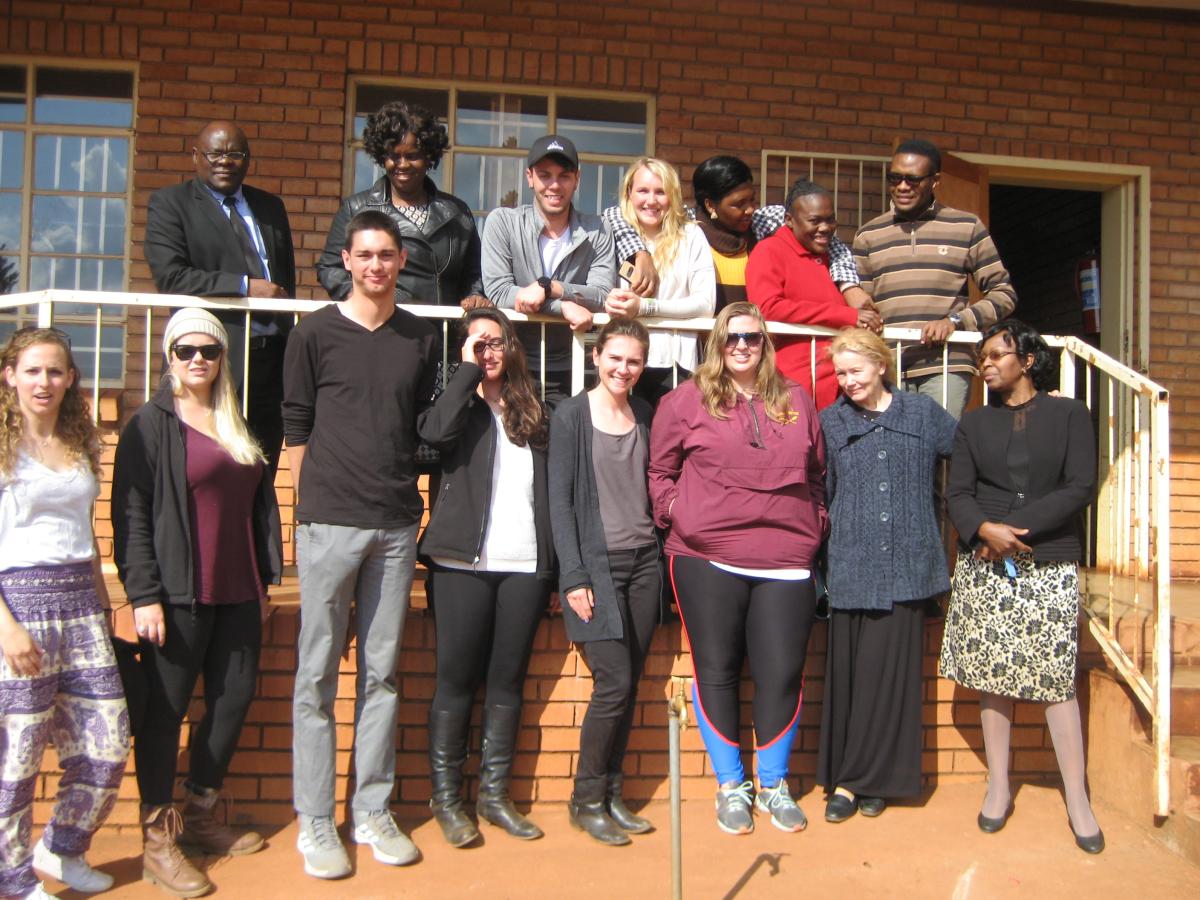 =Group of students standing on a front porch in South Africa